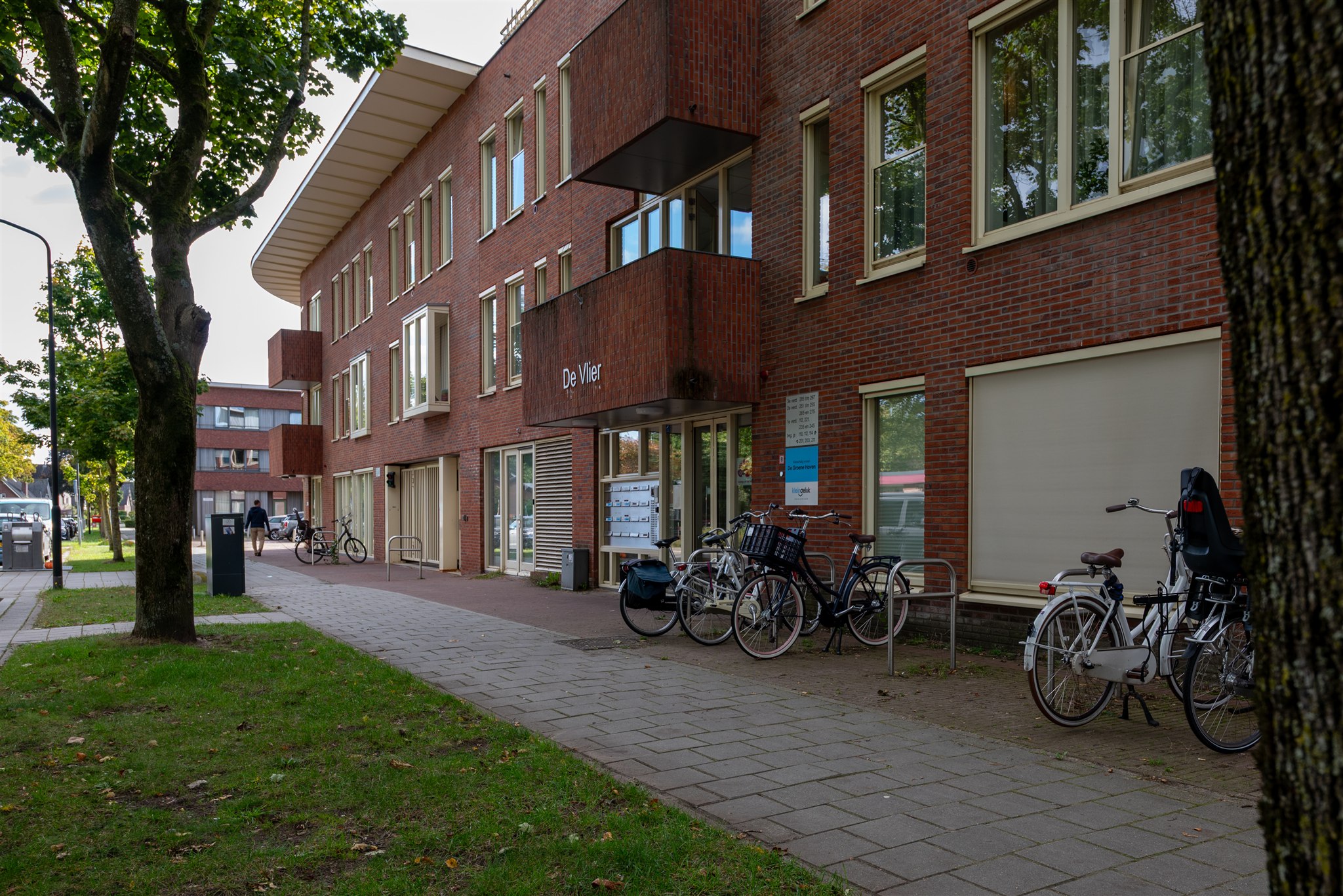 Side entrance with bikes showing community use