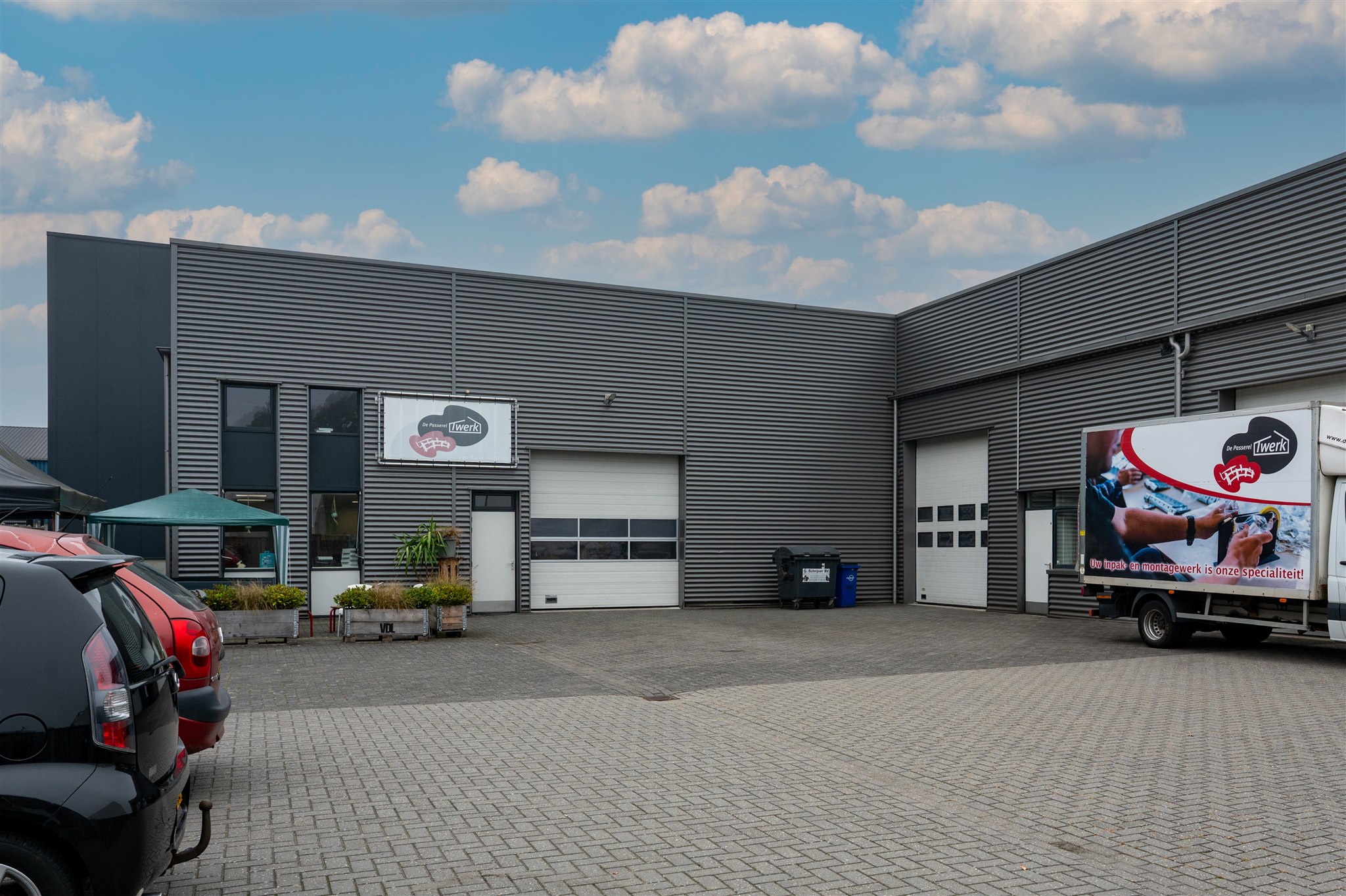Alternative angle showing building entrance and loading area